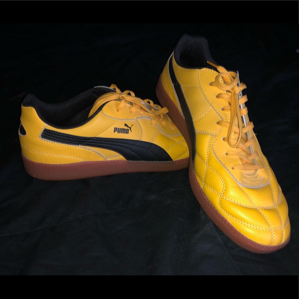 Men’s yellow Puma shoes